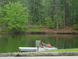 two people fishing on the stamp creek boat loading dock